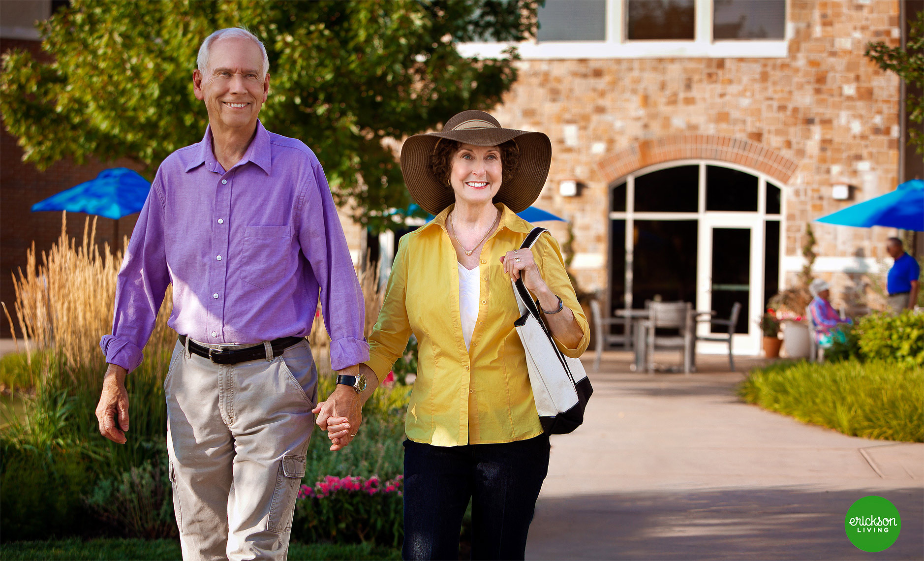 lifestyle-photograph-of-walking-couple-at-senior-living-courtyard-detroit-photographer-scott-stewart